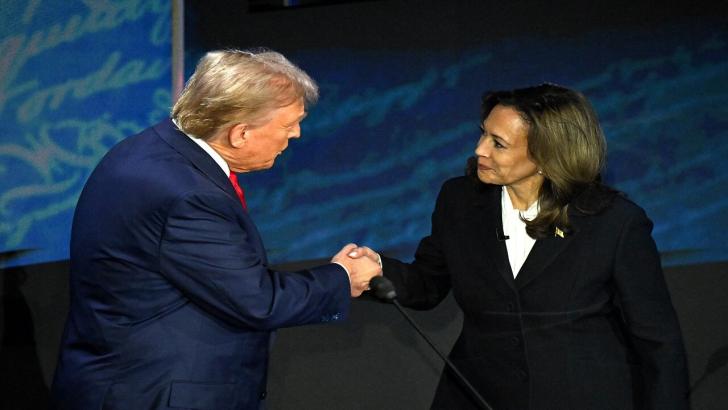 Presidential candidates Donald Trump and Kamala Harris shake hands